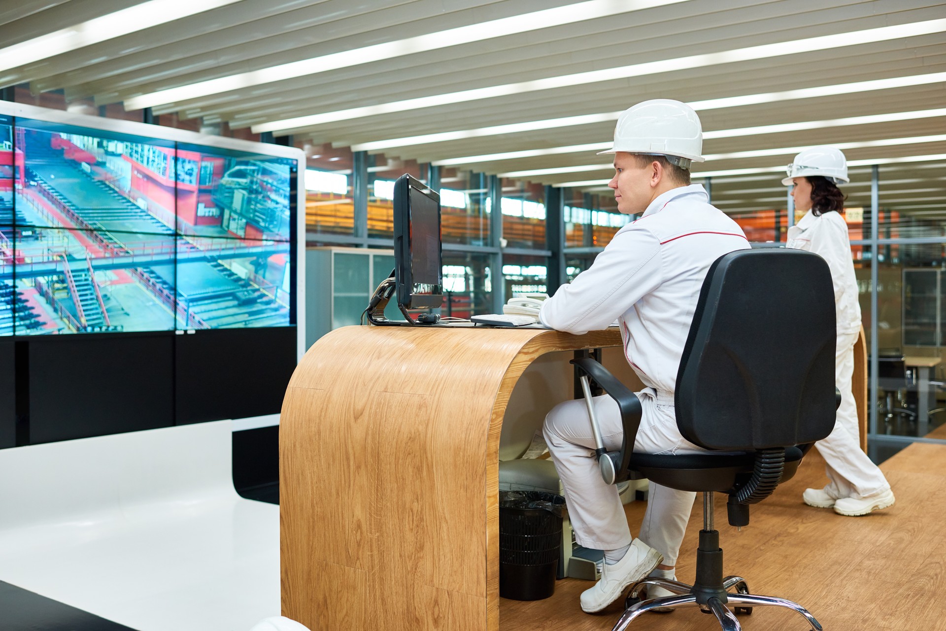 Assembly technicians controlling work of machines